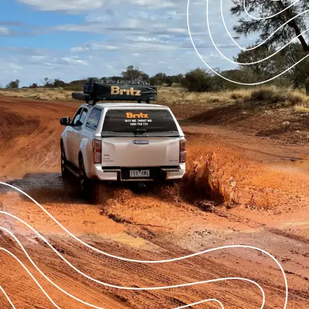 4WD Camper on a muddy dirt Road