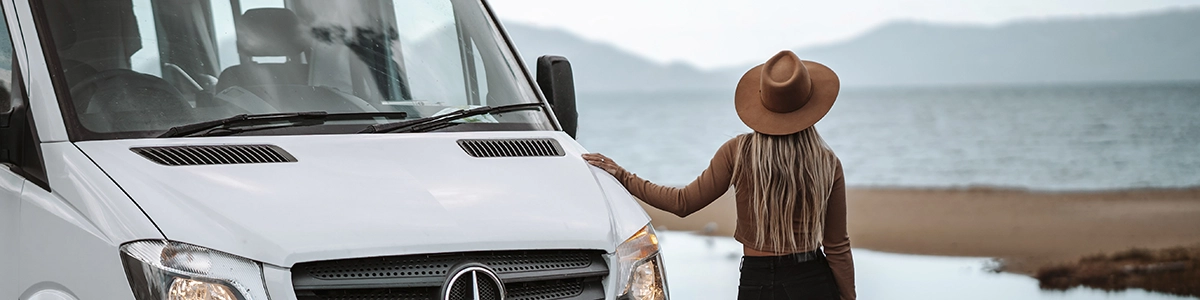 Woman next to a motorhome in Tasmania