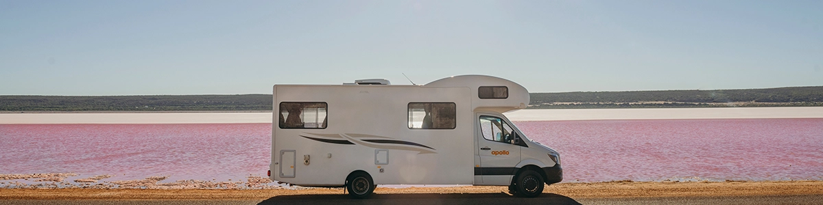 Motorhome Parked Next To Pink Lake